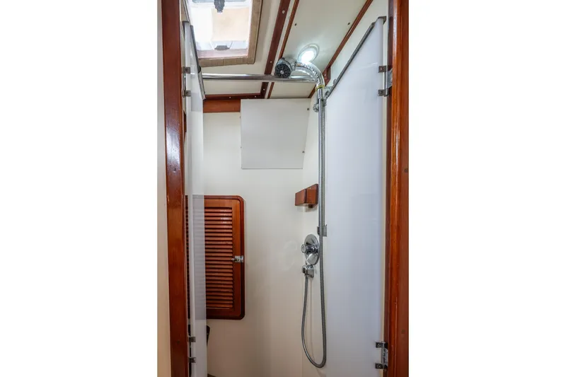 Slide: The Image of Shower area in 1992 Morris Ocean Series 44 yacht, featuring wooden accents and modern fixtures. - 48