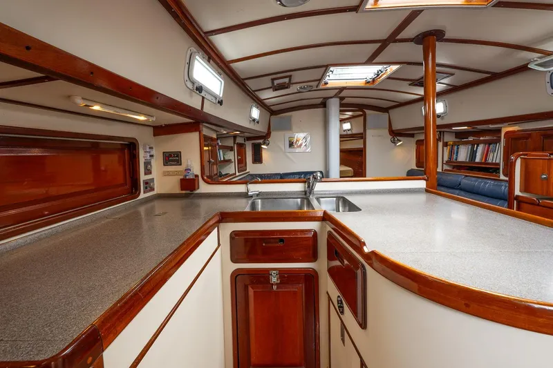 Slide: The Image of Interior of 1992 Morris Ocean Series 44 yacht with wooden cabinetry and spacious countertops. - 25