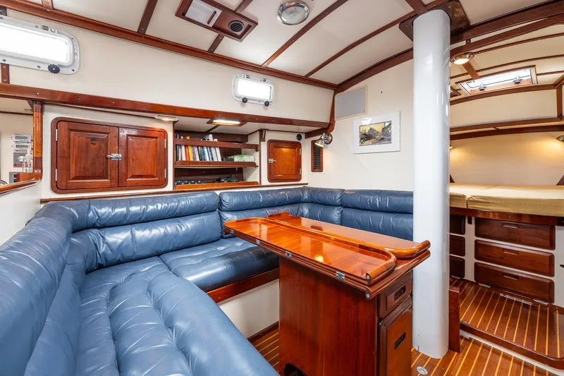 Slide: The Image of Luxurious 1992 Morris Ocean Series 44 yacht interior with blue leather seating and wooden accents. - 32