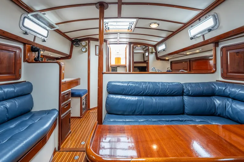 Slide: The Image of Luxurious interior of 1992 Morris Ocean Series 44 yacht with blue leather seating and wood finishes. - 40