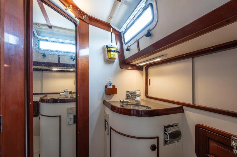 Slide: The Image of Luxurious bathroom interior of 1992 Morris Ocean Series 44 yacht with wooden accents. - 49