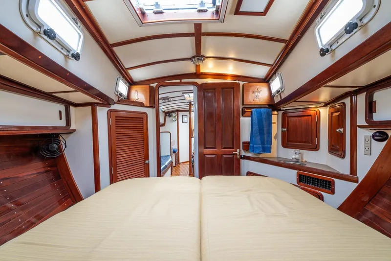 Slide: The Image of Interior of 1992 Morris Ocean Series 44 yacht, featuring elegant wood paneling and cozy cabin design. - 38