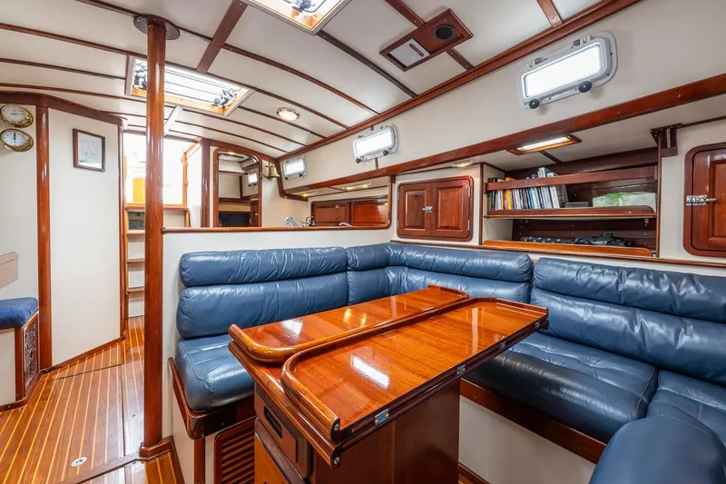 Slide: The Image of Luxurious interior of 1992 Morris Ocean Series 44 yacht with blue leather seating and wooden accents. - 41