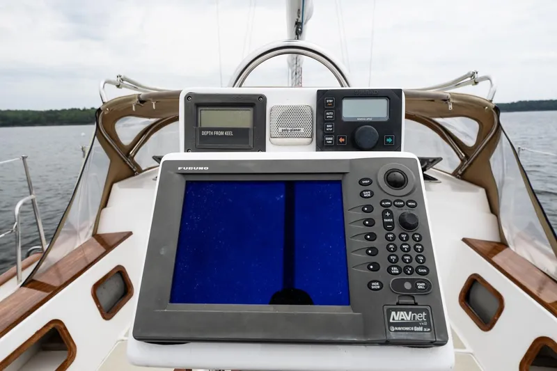Slide: The Image of Cockpit navigation equipment on 1992 Morris Ocean Series 44 sailboat, featuring Furuno and Simrad displays. - 20