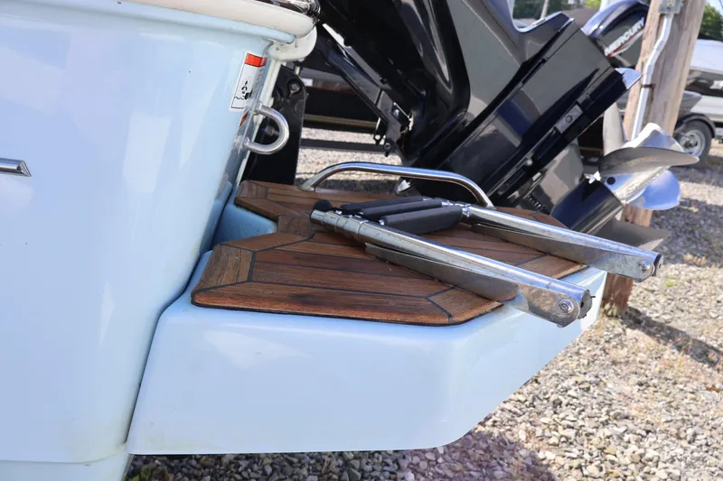 Slide: The Image of 2023 Boston Whaler 170 Montauk boat with teak swim platform and ladder. - 11