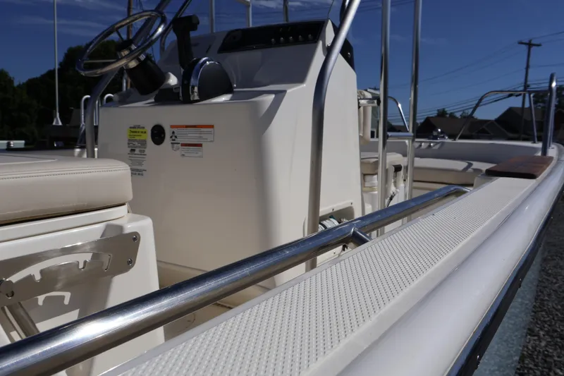 Slide: The Image of 2023 Boston Whaler 170 Montauk boat interior with steering console and seating. - 16