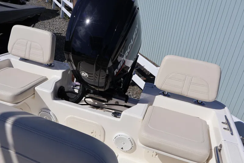 Slide: The Image of 2023 Boston Whaler 170 Montauk boat with Mercury engine and cushioned seating. - 19