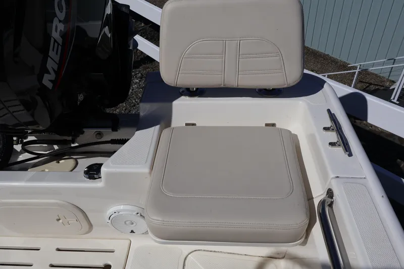 Slide: The Image of 2023 Boston Whaler 170 Montauk boat seating area with Mercury engine. - 20
