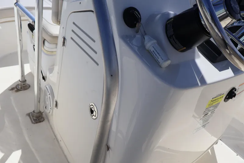 Slide: The Image of 2023 Boston Whaler 170 Montauk boat console with steering wheel and control panel. - 27