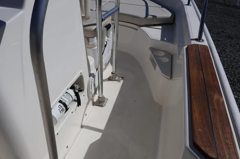 Slide: The Image of 2023 Boston Whaler 170 Montauk interior with seating and safety equipment. - 28
