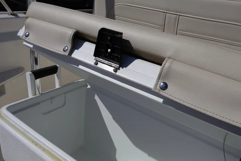 Slide: The Image of 2023 Boston Whaler 170 Montauk boat seat with storage compartment open. - 32