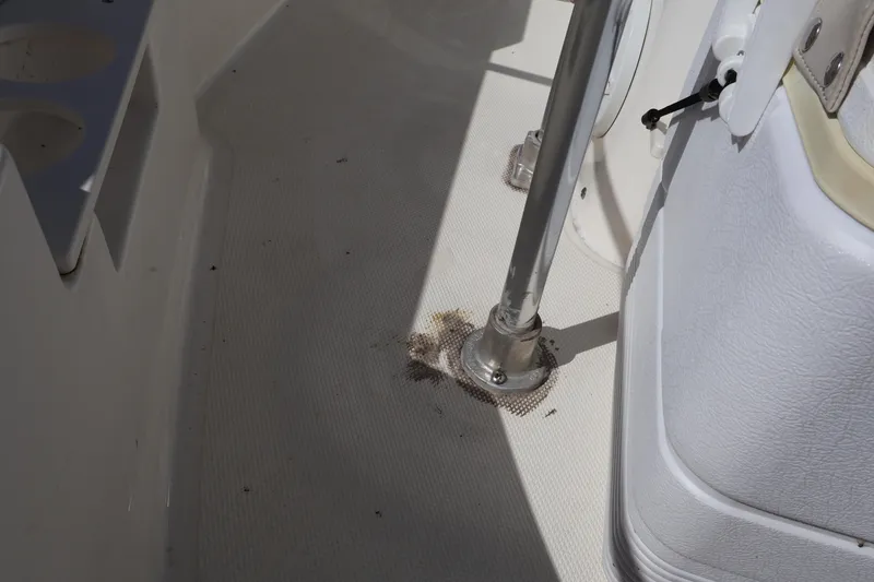Slide: The Image of Interior view of a 2023 Boston Whaler 170 Montauk boat, showing seating and floor details. - 34