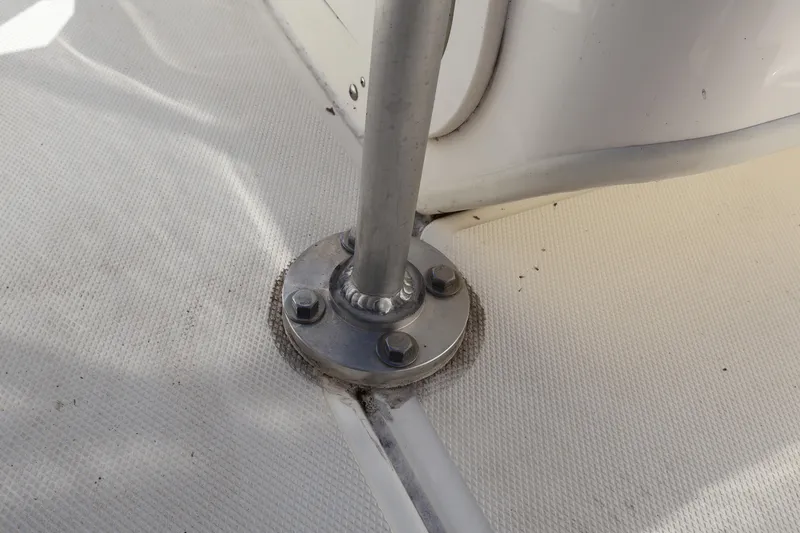 Slide: The Image of Close-up of a 2023 Boston Whaler 170 Montauk boat's metal fixture on deck. - 35