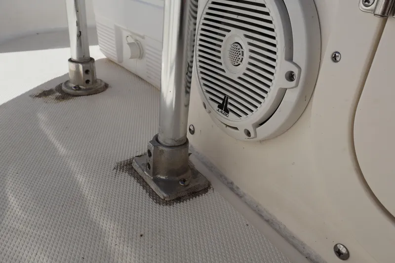Slide: The Image of 2023 Boston Whaler 170 Montauk boat interior with speaker and metal fittings. - 37