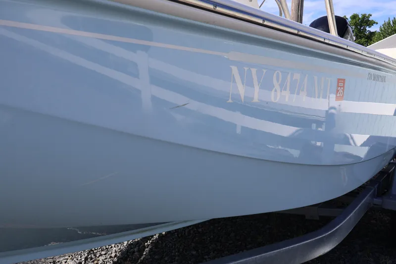 Slide: The Image of 2023 Boston Whaler 170 Montauk boat with registration number NY 8474 MT on trailer. - 9