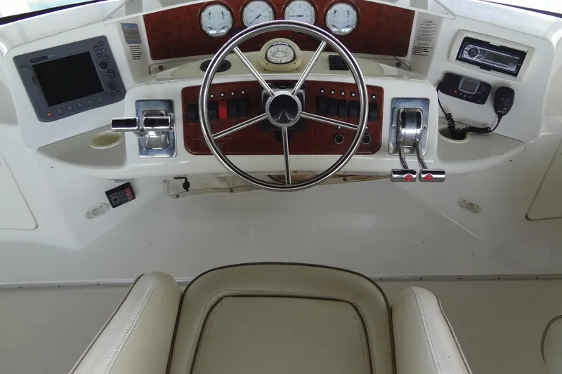 Slide: The Image of Helm of 2005 Silverton 34 Convertible with steering wheel and control panel. - 21