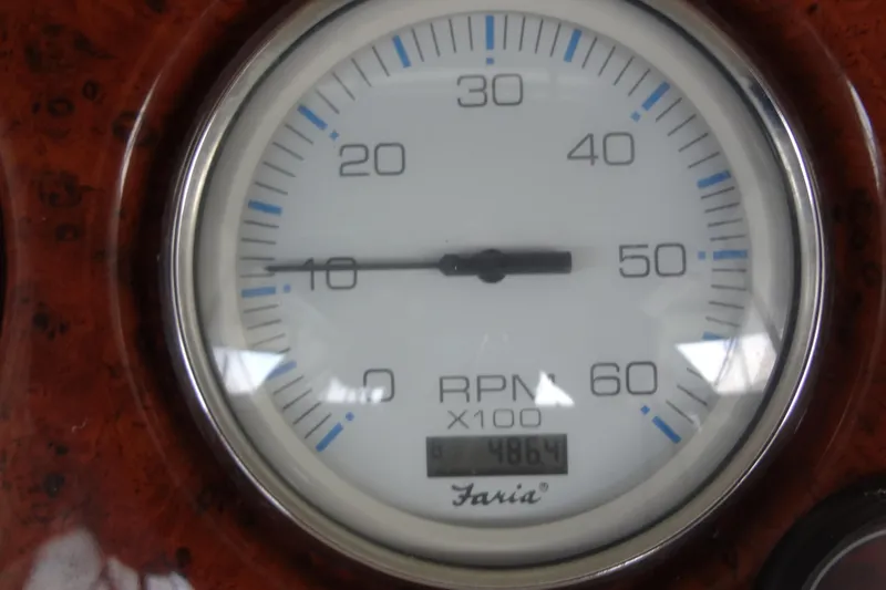 Slide: The Image of Tachometer of 2005 Silverton 34 Convertible boat, displaying RPM and hours. - 24