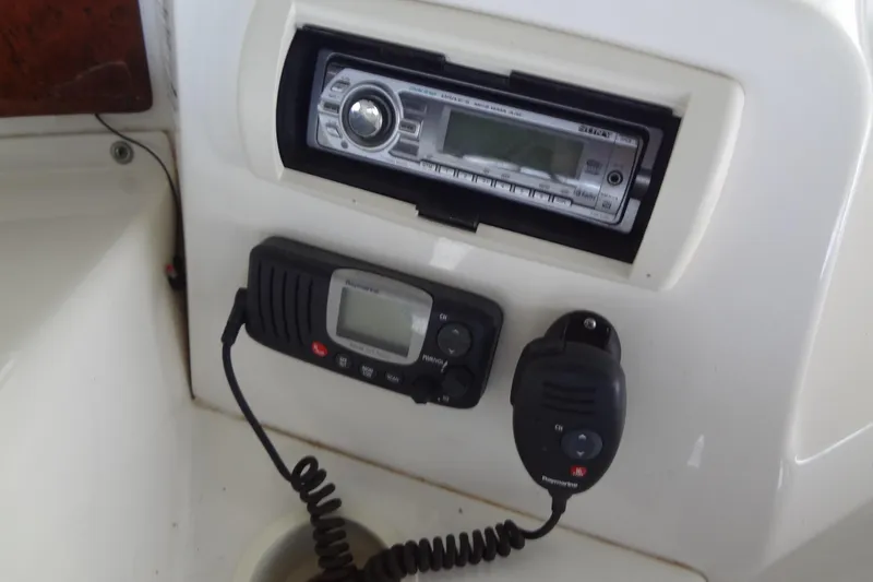 Slide: The Image of Control panel of a 2005 Silverton 34 Convertible boat with radio and communication devices. - 26