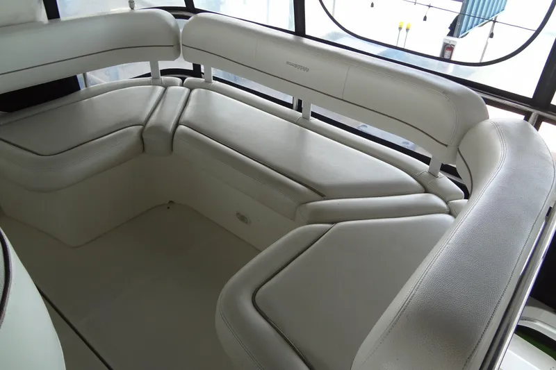 Slide: The Image of 2005 Silverton 34 Convertible boat interior with white cushioned seating. - 29