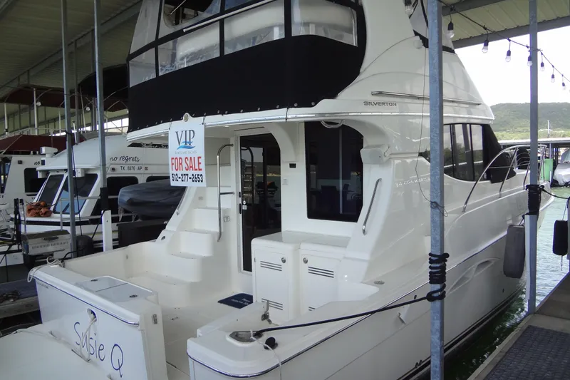 Slide: The Image of 2005 Silverton 34 Convertible yacht for sale at marina dock. - 3