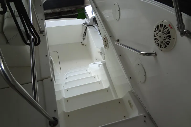 Slide: The Image of 2005 Silverton 34 Convertible boat interior with white steps and stainless steel railings. - 32
