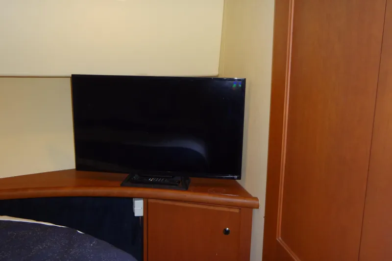 Slide: The Image of Flat-screen TV in 2005 Silverton 34 Convertible yacht interior. - 47