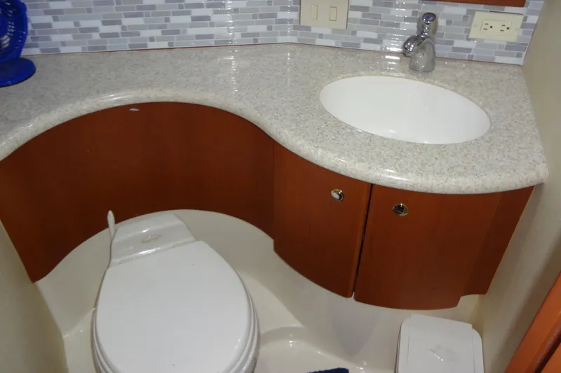 Slide: The Image of Bathroom interior of 2005 Silverton 34 Convertible yacht with sink and toilet. - 49