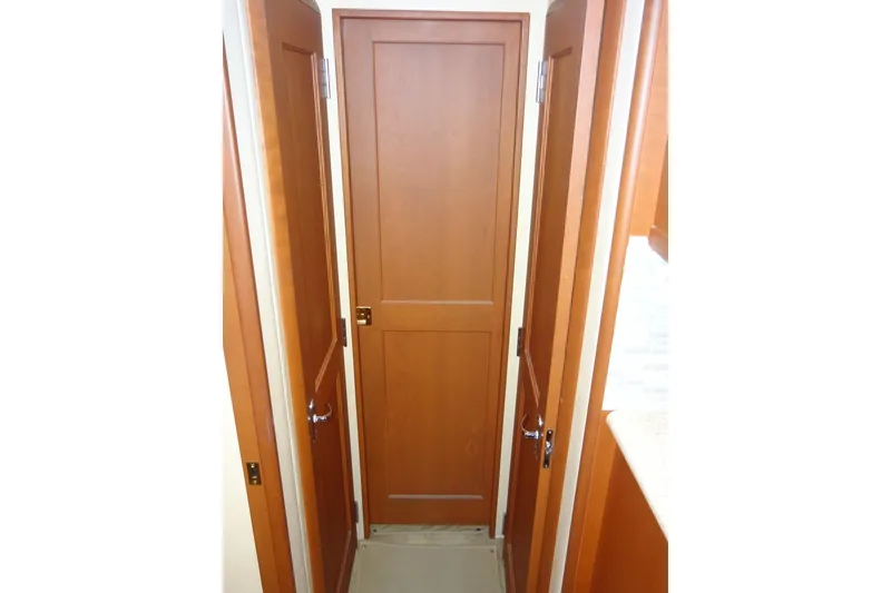Slide: The Image of Interior view of 2005 Silverton 34 Convertible boat with wooden doors. - 52