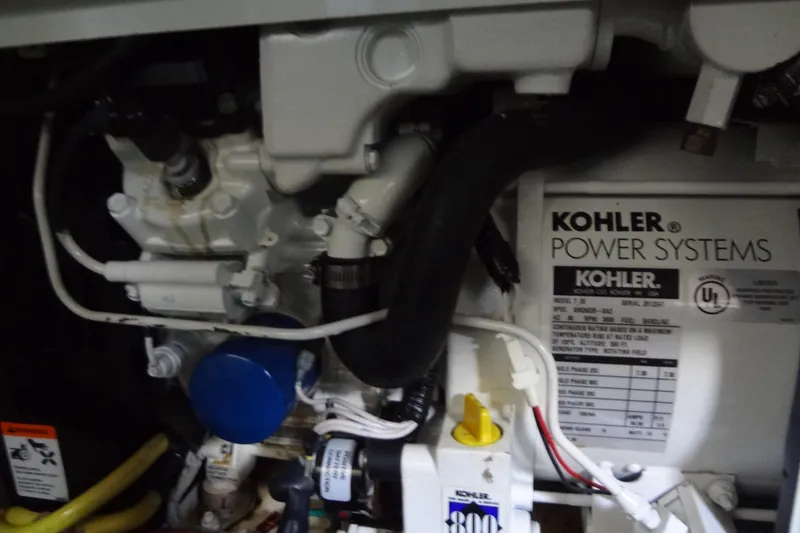 Slide: The Image of Engine compartment of a 2005 Silverton 34 Convertible with Kohler power system. - 56