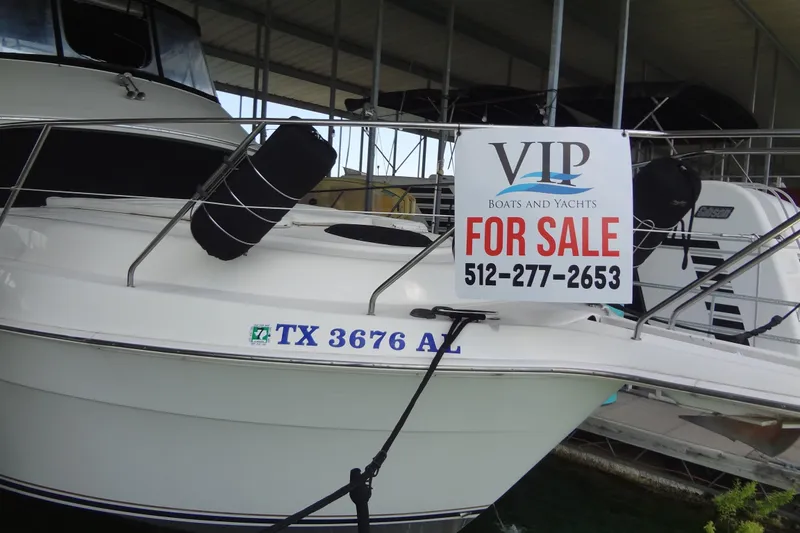 Slide: The Image of 2005 Silverton 34 Convertible boat for sale with contact number displayed. - 6