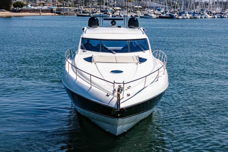 Slide: The Image of Front view of a 2005 Sunseeker Predator 68 yacht on calm water. - 4