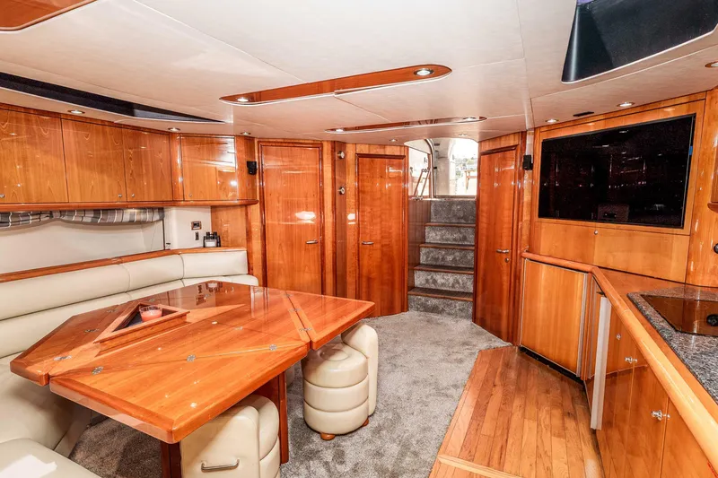 Slide: The Image of Luxurious interior of 2005 Sunseeker Predator 68 yacht with elegant wood finishes and modern amenities. - 11