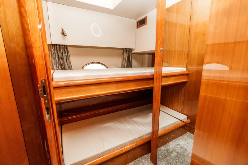 Slide: The Image of Bunk beds in 2005 Sunseeker Predator 68 yacht cabin with wooden interior. - 36