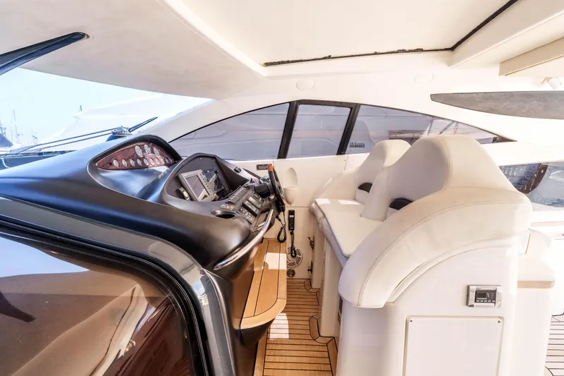 Slide: The Image of Interior cockpit of 2005 Sunseeker Predator 68 yacht with modern controls and seating. - 4