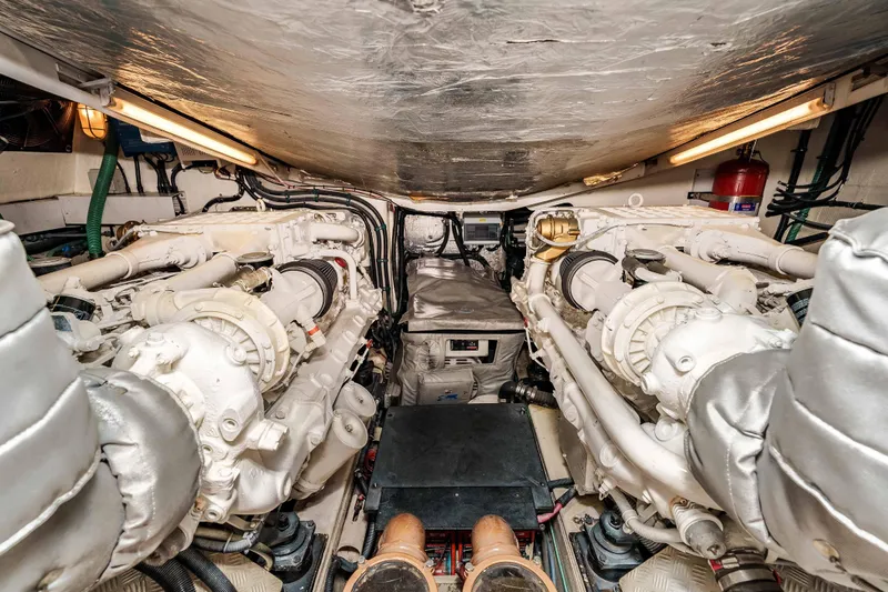 Slide: The Image of Engine room of 2005 Sunseeker Predator 68 yacht, showcasing dual engines and mechanical components. - 37