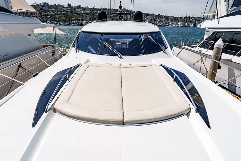Slide: The Image of 2005 Sunseeker Predator 68 yacht with sunbathing deck, docked in a marina. - 7