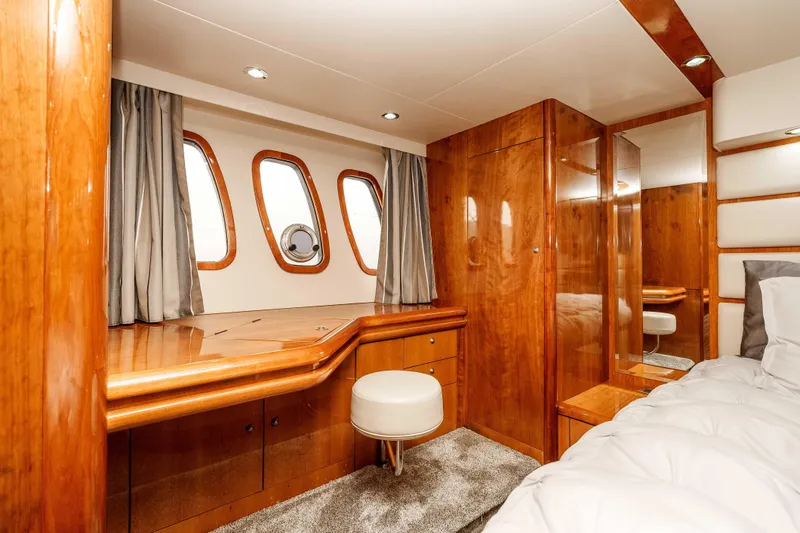 Slide: The Image of Luxurious cabin interior of 2005 Sunseeker Predator 68 yacht with wood finish and porthole windows. - 27