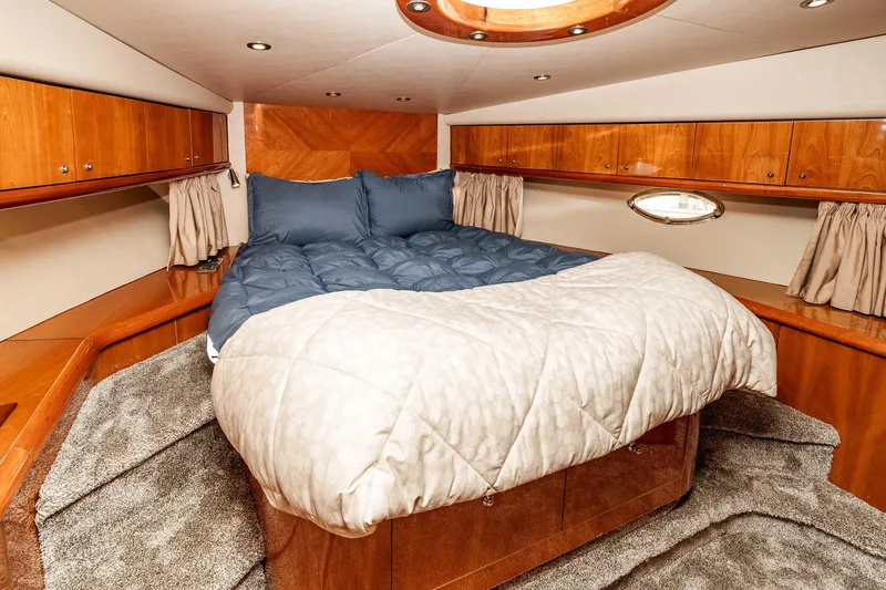 Slide: The Image of Luxurious cabin interior of 2005 Sunseeker Predator 68 yacht with cozy bedding. - 30