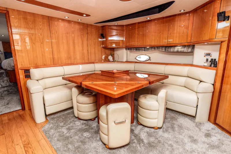 Slide: The Image of Luxurious interior of a 2005 Sunseeker Predator 68 yacht with elegant wood finishes. - 9