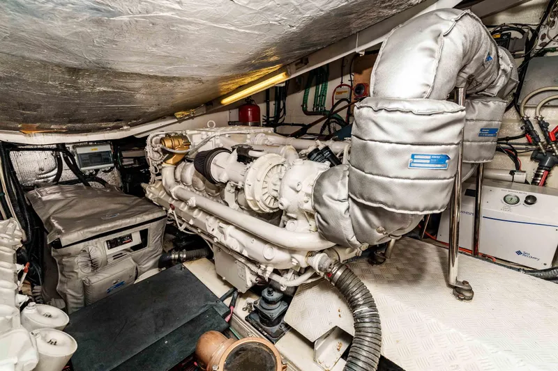Slide: The Image of Engine room of 2005 Sunseeker Predator 68 yacht, showcasing machinery and equipment. - 39