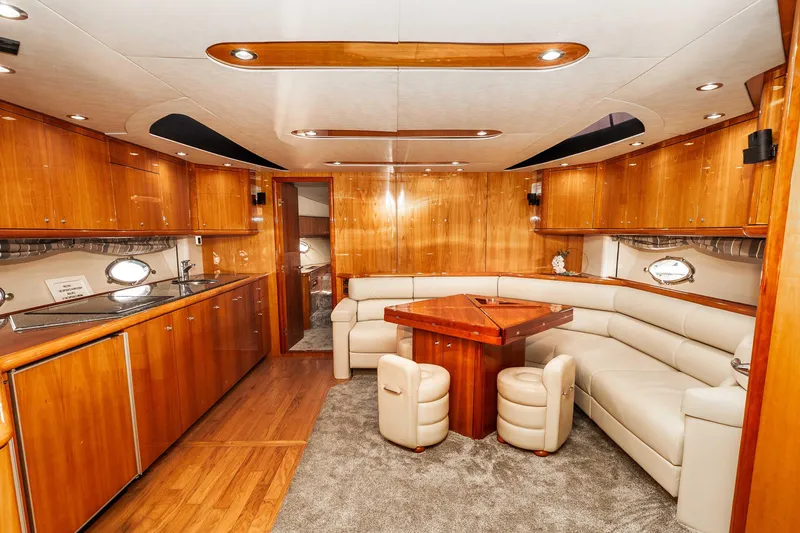 Slide: The Image of Luxurious interior of 2005 Sunseeker Predator 68 yacht with elegant wood finishes and plush seating. - 17