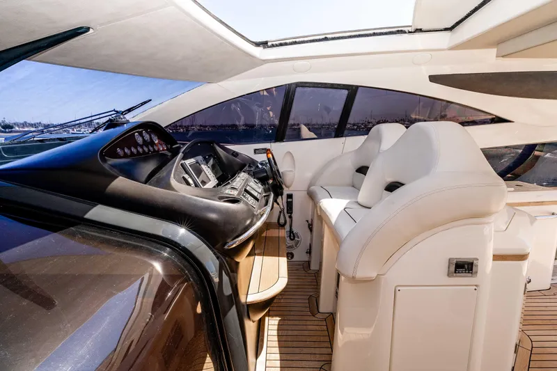 Slide: The Image of Luxurious interior of 2005 Sunseeker Predator 68 yacht with modern helm and plush seating. - 14