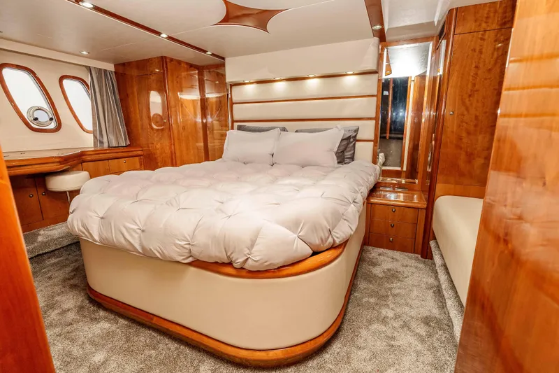 Slide: The Image of Luxurious bedroom interior of 2005 Sunseeker Predator 68 yacht with elegant wood finishes. - 25