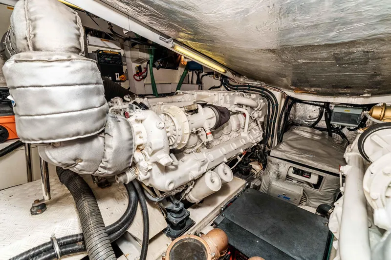 Slide: The Image of Engine room of a 2005 Sunseeker Predator 68 yacht, showcasing mechanical components. - 38