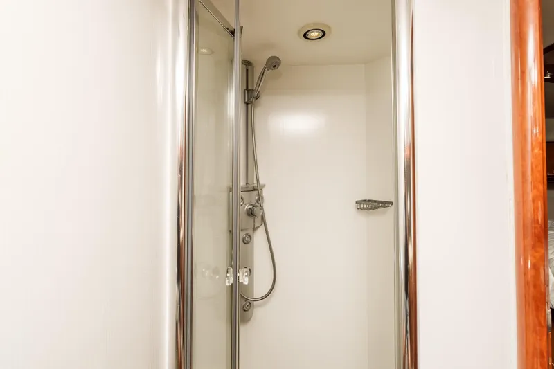 Slide: The Image of Shower area inside 2005 Sunseeker Predator 68 yacht, featuring modern fixtures and glass door. - 35