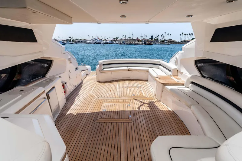 Slide: The Image of Luxurious 2005 Sunseeker Predator 68 yacht interior with elegant seating and ocean view. - 10
