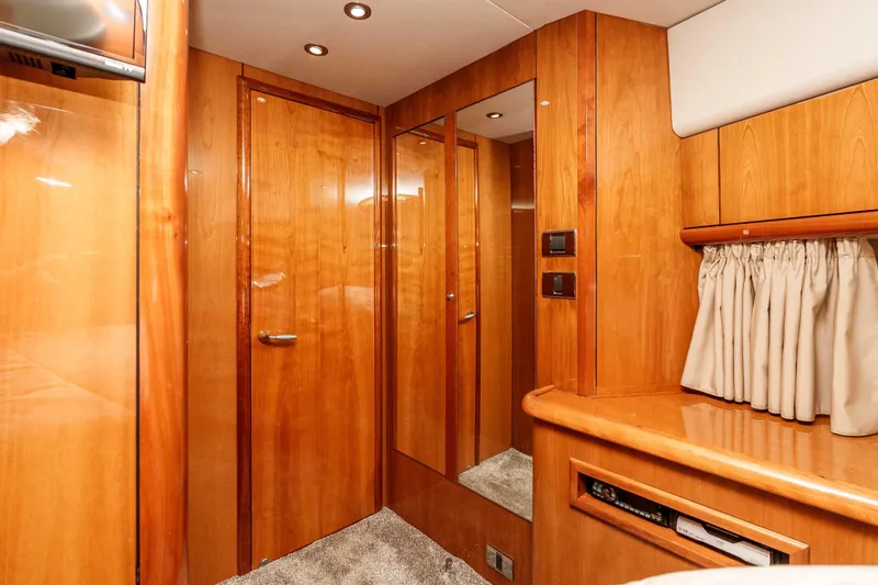 Slide: The Image of Luxurious wooden interior of 2005 Sunseeker Predator 68 yacht cabin. - 32