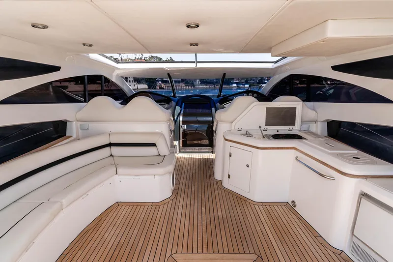 Slide: The Image of Luxurious interior of a 2005 Sunseeker Predator 68 yacht with sleek seating and modern amenities. - 12