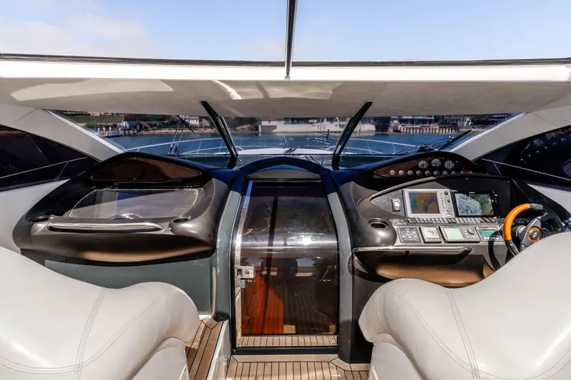 Slide: The Image of Interior cockpit view of 2005 Sunseeker Predator 68 yacht, featuring modern navigation equipment. - 13