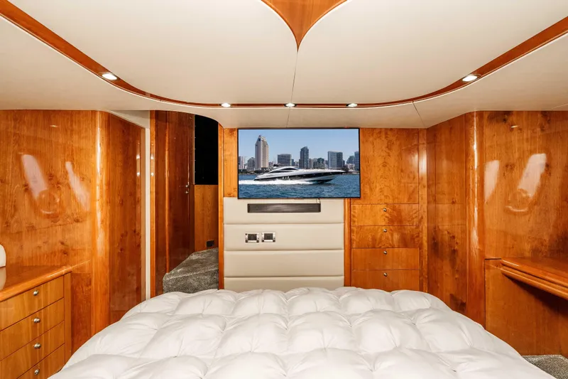 Slide: The Image of Luxurious cabin interior of 2005 Sunseeker Predator 68 yacht with wood paneling and TV. - 26